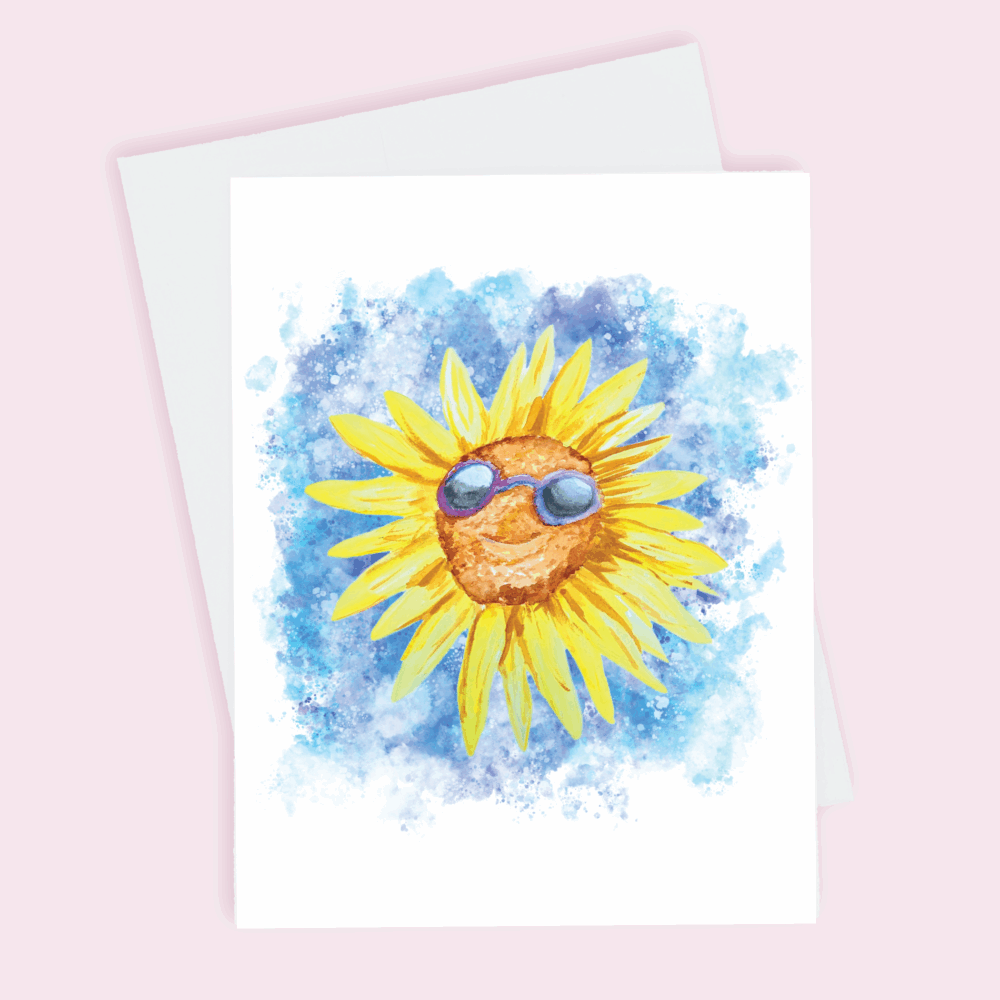 A greeting card depicting a sunflower with sunglasses against a blue splattered background done in watercolor.